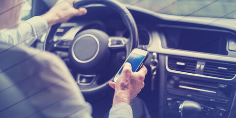 Man using a smartphone and driving, geometric pattern