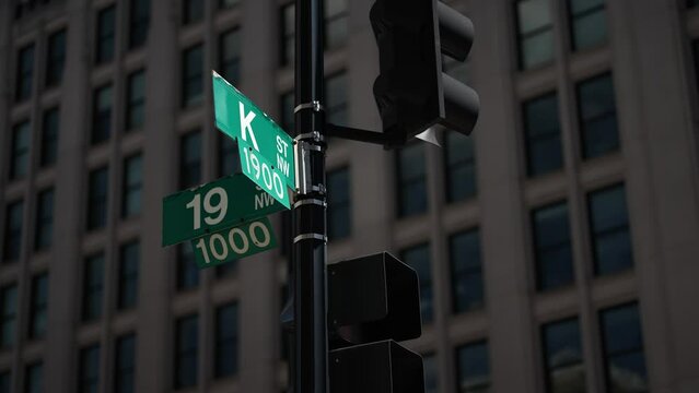 K street nw and 20th street nw street signs in downtown Washington DC symbolizing lobbying and corruption in nations capital