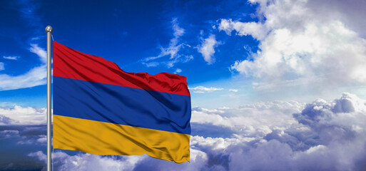 Armenia national flag cloth fabric waving on beautiful Blue Sky Background.
