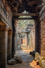 The ancient sand stone bricks and carving at Banteay Kdei temple in Siem Reap, Cambodia