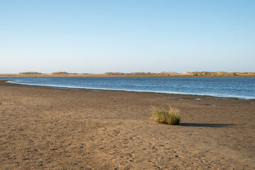 Landscape of the tide going down on a beach in the province of Huelva.