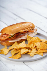 delicious lyoner jalapeno sandwich with tomato cucumber and a thin slice of beef pastrami