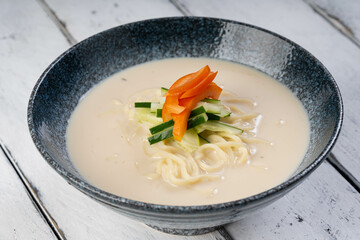 Korean cold soybean noodle soup also known as kongguksu 