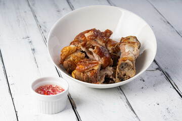 crispy pata or deep fried pork leg with a sweet white vinaigrette sauce, it is a well known food in...