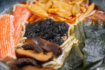 spicy kani mushroom, bamboo shoots and black moss noodles