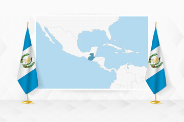 Map of Guatemala and flags of Guatemala on flag stand. - 782028674
