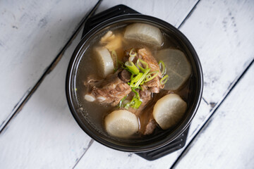 pork bone soup with sliced radish and scallions 