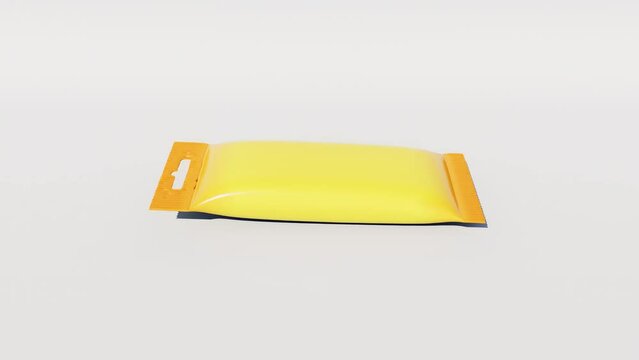 A soft yellow package falls on a white background. 3d animation