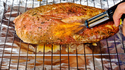 we burn homemade ham with a flame from a gas burner to add taste and aroma