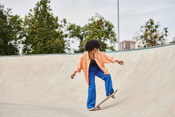 A young African American woman with curly hair boldly rides her skateboard up the side of a ramp at...