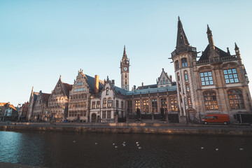 Ghent waterfront called the Graslei and the charming historic houses at sunrise. The centre of the Belgian city. Flanders - obrazy, fototapety, plakaty