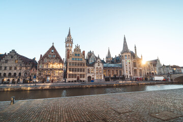 Fototapeta na wymiar Ghent waterfront called the Graslei and the charming historic houses at sunrise. The centre of the Belgian city. Flanders
