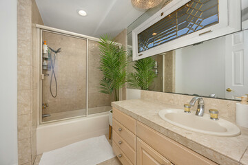 Bathroom with sink, mirror, and shower in Hidden Hills, CA