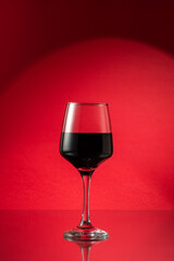 Close-up view of red wine glass. Wine drink concept.