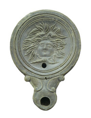 Ancient Roman oil lamp with the head of Medusa Gorgon