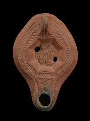 Ancient Roman oil lamp with the zodiac sign of the pisces i