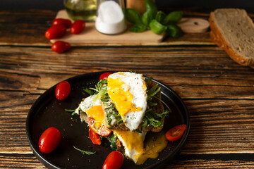 Sandwich with egg. on a wooden background. breakfast