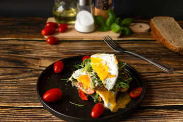 Sandwich with egg. on a wooden background. breakfast