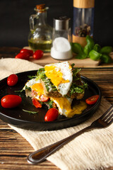 Sandwich with egg. on a wooden background. breakfast