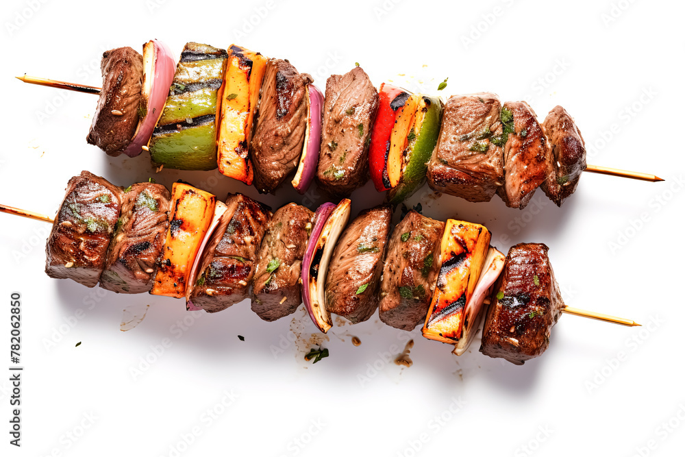 Poster two skewers of meat with vegetables on them. the vegetables are peppers and onions. the skewers are 