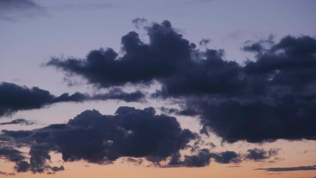 Atmosphere. Weather during sunset or sunrise.clouds slow motion. Beautiful evening and blue sky. 
