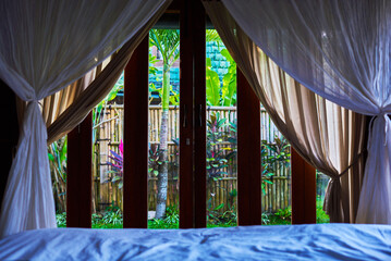 Beautiful tropical beach houses in lush garden. Tioman tropical island, Malaysia.