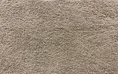 Beige rug material pattern texture textile background close up.

