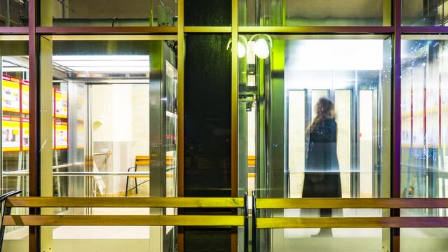 time-lapse People move quickly on the elevator in the supermarket