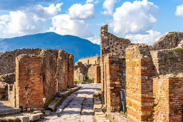 ancient buildings and walls in archeological excavation In Pompeii , Italy. Streets and historical...