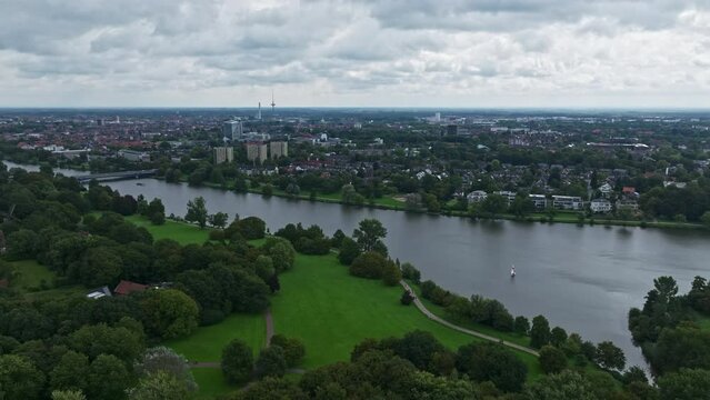 An aerial drone view of Aasee Lake in M&uuml;nster . Lake Aasee is an artificial lake located in M&uuml;nster , Germany .