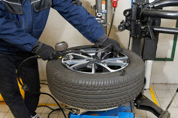 Car maintenance and service center. Vehicle tire repair and replacement equipment. Seasonal tire...