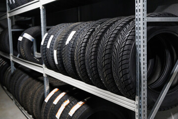 New car tires on rack in auto store