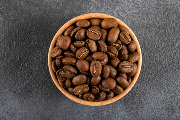 A bowl full of roasted coffee beans,top view