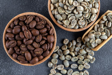 Green coffee with roasted coffee beans on black background
