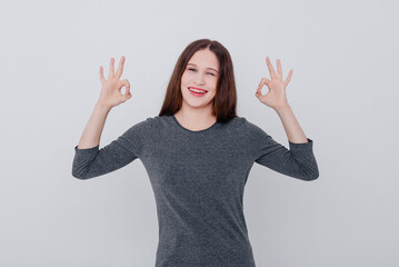 young woman shows ok gesture