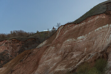 Fototapeta premium Stony pebble and clay banks of the Volga River. Mountain slope of various stone rocks. Tetyushi, Tatarstan.