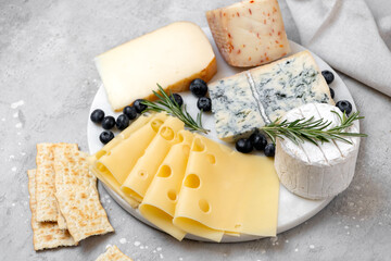 Cheese platter with craft cheese assortment  hard cheeses, mold cheese, gorgonzola, pecorino,...