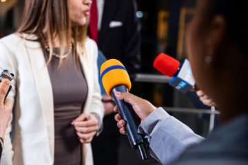 Political speech of EU consul during press campaign. Confident female European politician answers...