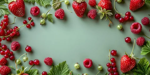 Fototapeten Summer berries on light green background, flat lay banner with copy space, vacation concept © t.sableaux
