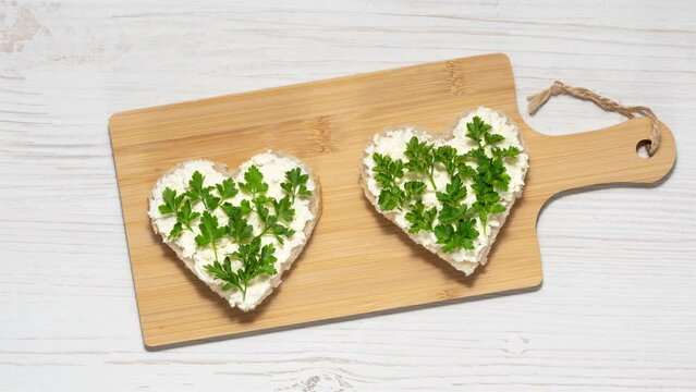 Sandwiches with cottage cheese and parsley. Healthy food concept, stop motion animation.