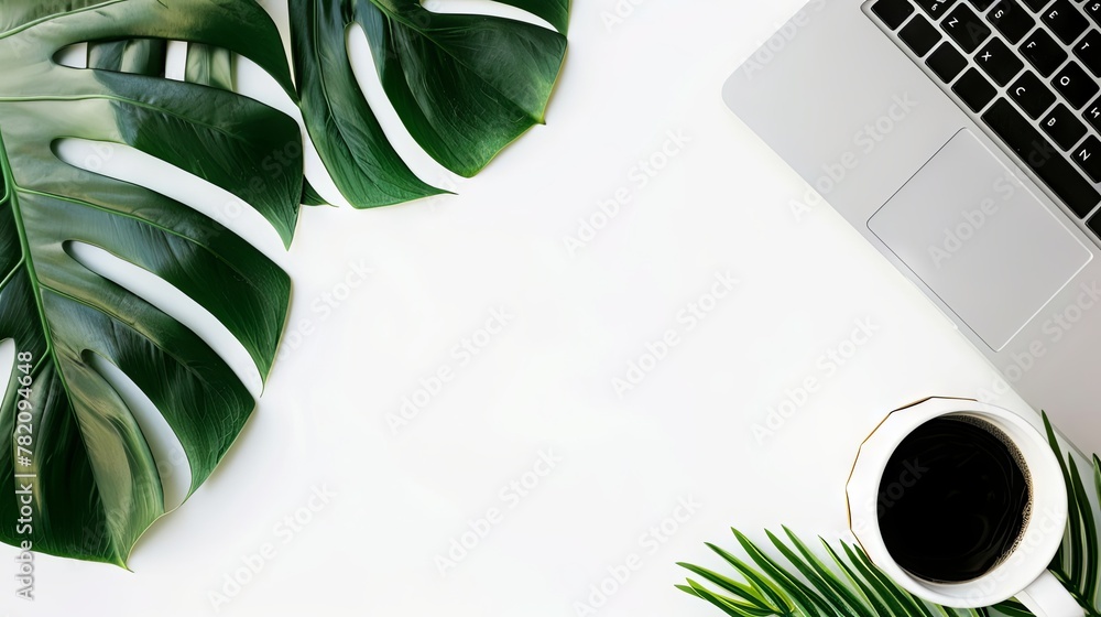Fototapete white empty background with a laptop and coffee in the right part of the image and a green leaf in t