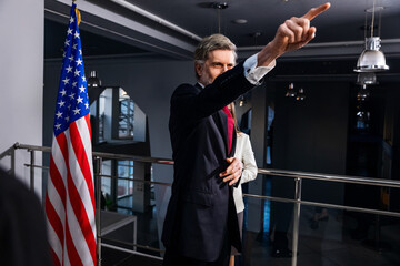 Positive United States Presidential Candidate gestures and poses for cameras after inspirational...