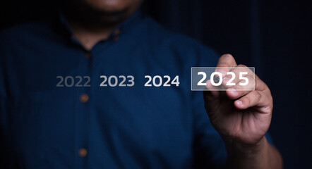 Trends 2025 year concept. Woman hold laptop and point finger touching virtual sequence count down...