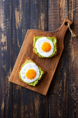 Toast with guacamole and eggs. Healthy eating. Breakfast.