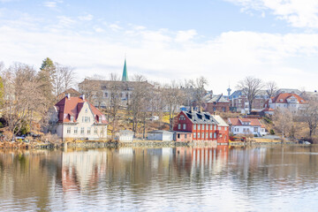 Naklejka na ściany i meble Walking along Nidelven (River) in a Spring mood in Trondheim city