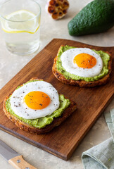 Toast with guacamole and eggs. Healthy eating. Breakfast.