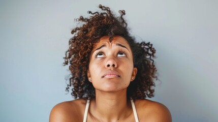 Woman With Curly Hair Looking Up