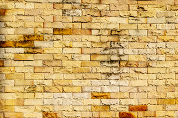 Yellow brick wall background.  Old red brick texture
