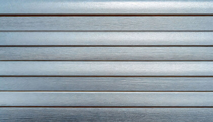 Close-up of weathered, Silver-painted wooden planks aligned horizontally.