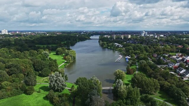An aerial drone view of Aasee Lake in M&uuml;nster . Lake Aasee is an artificial lake located in M&uuml;nster , Germany .